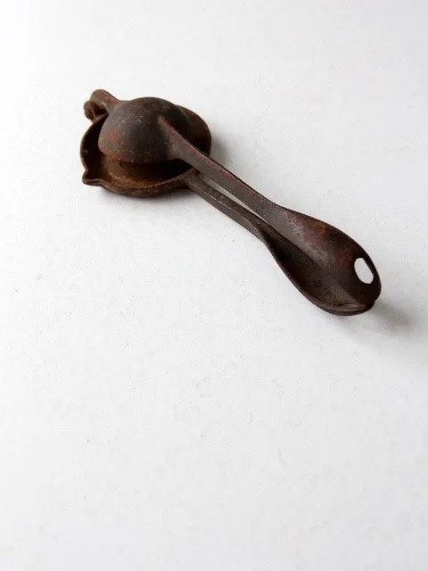 vintage hand-held juice squeezer